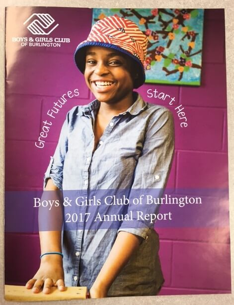 boys and girls club annual report cover with young girl smiling in front of purple background